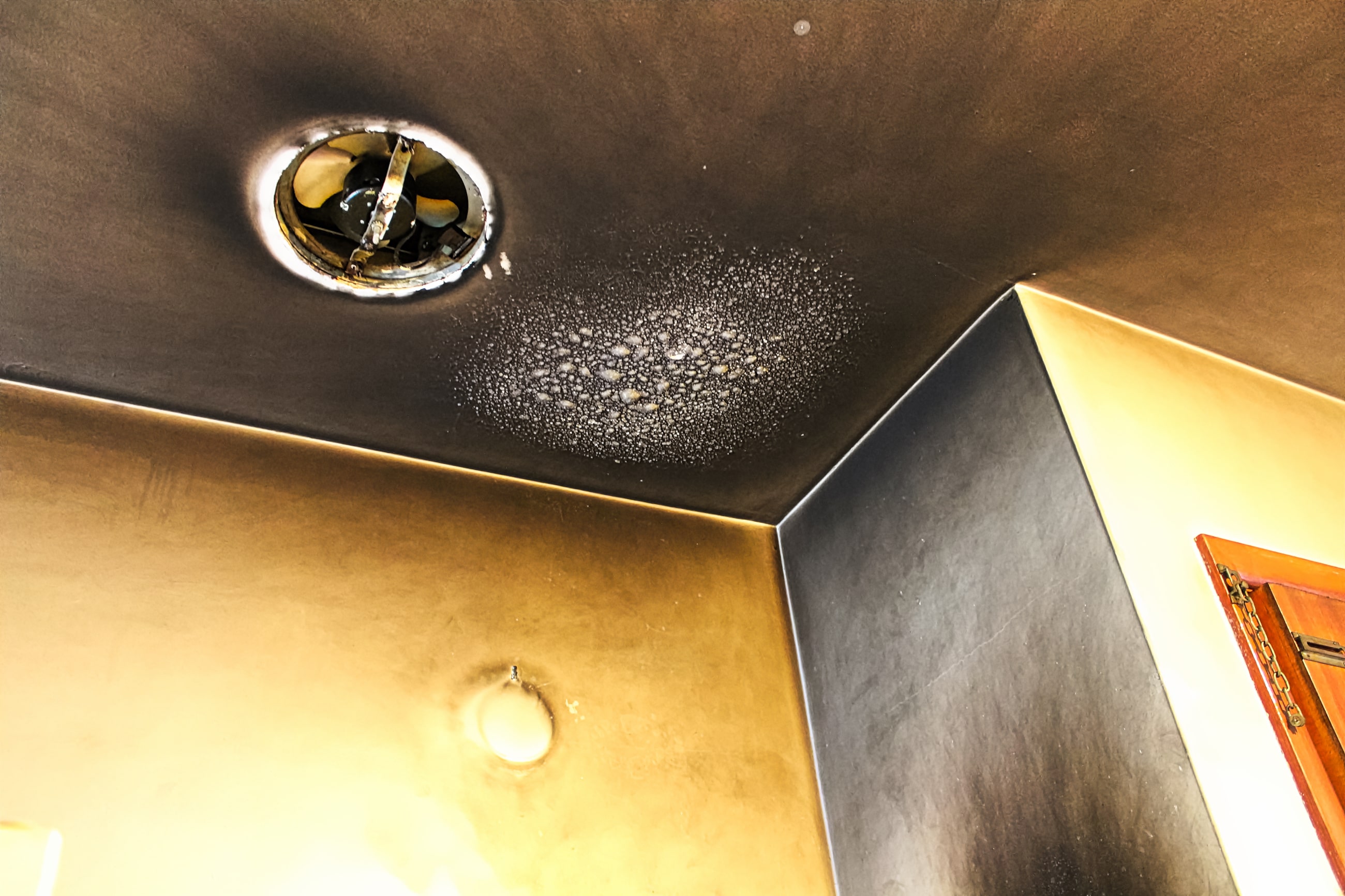 A smoke-damaged ceiling before fire damage restoration service